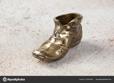 depositphotos_320976654-stock-photo-old-brass-ashtray-in-the.jpg